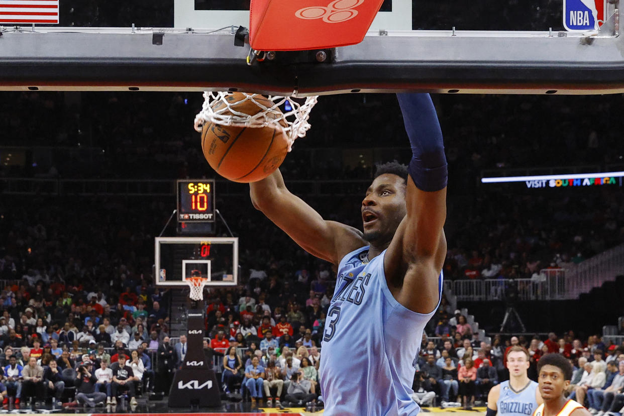 ATLANTA, GA - MARCH 26: Jaren Jackson Jr. #13 of the Memphis Grizzlies dunks during the first half against the Atlanta Hawks at State Farm Arena on March 26, 2023 in Atlanta, Georgia. NOTE TO USER: User expressly acknowledges and agrees that, by downloading and or using this photograph, User is consenting to the terms and conditions of the Getty Images License Agreement. (Photo by Todd Kirkland/Getty Images)