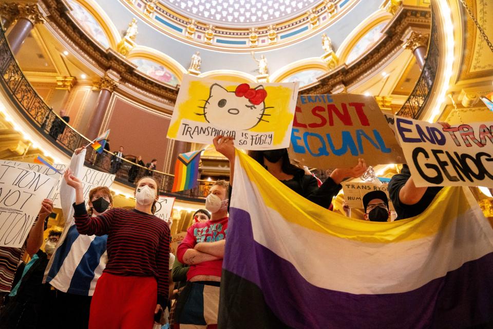 Protesters gather in opposition to HF2389 as lawmakers hold a hearing for the bill that would set legal definitions for the words "man" and "women" Monday, Feb. 12, 2024, at the Iowa State Capitol.