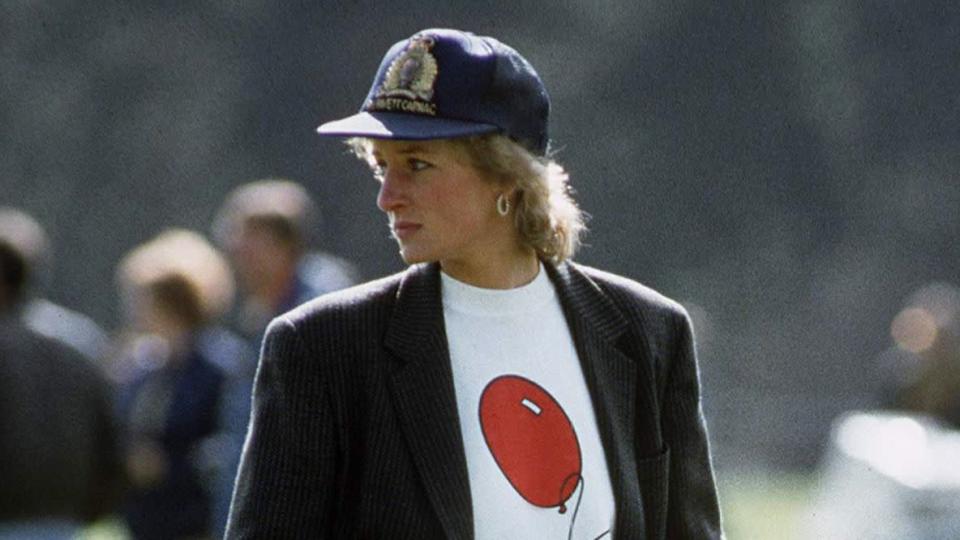 Diana, Princess Of Wales At Guards Polo Club. The Princess Is Casually Dressed In A Sweatshirt With The British Lung Foundation Logo On The Front, Jeans, Boots And A Baseball Cap