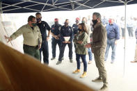 Democratic vice presidential candidate Sen. Kamala Harris, D-Calif., and California Gov. Gavin Newsom are briefed on the damage during the Creek Fire at Pine Ridge Elementary, Tuesday, Sept. 15, 2020 in Auberry, Calif. (AP Photo/Gary Kazanjian)