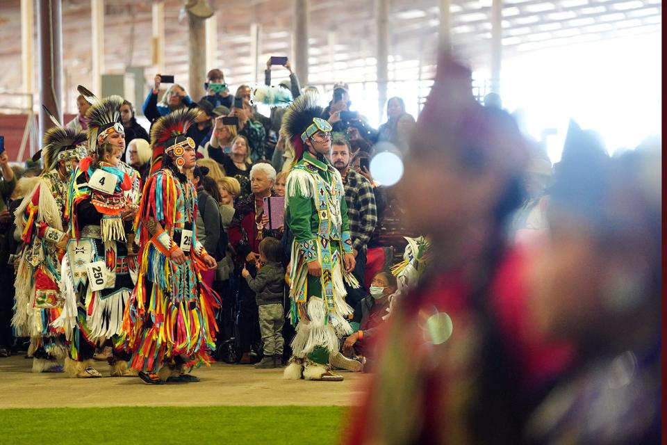 Dancers enter the circle during the grand entry Saturday at the Austin Powwow.