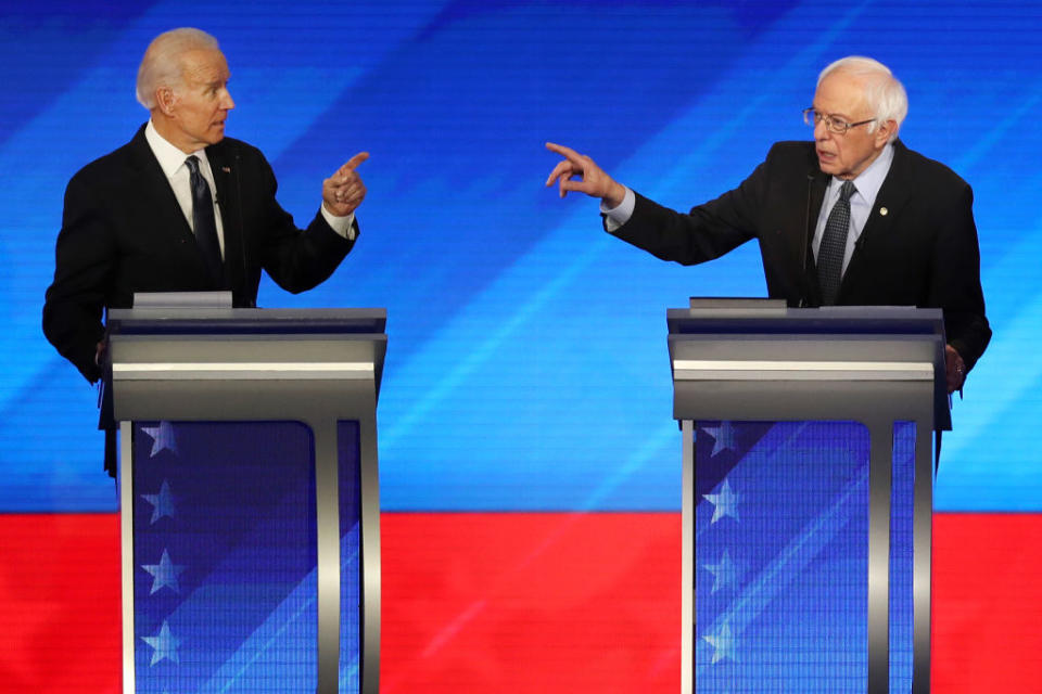 Democratic presidential candidates former Vice President Joe Biden and Vermont Sen. Bernie Sanders participate in the Democratic presidential debate on Feb. 07, 2020 in Manchester, New Hampshire. | Joe Raedle—Getty Images