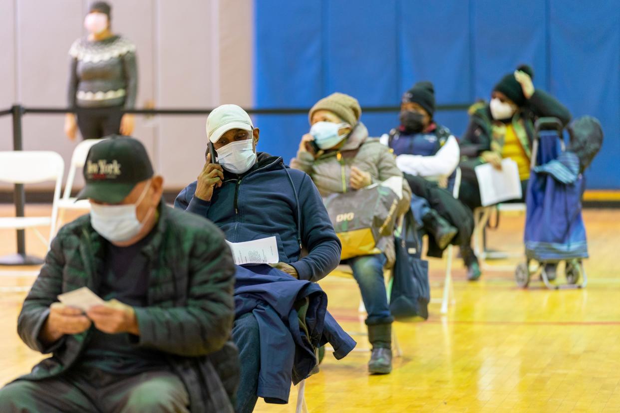 Seniors wait in the recovery area after receiving the first dose of the coronavirus vaccine at a pop-up COVID-19 vaccination site at the Bronx River Community Center, Sunday, Jan. 31, 2021, in the Bronx borough of New York.