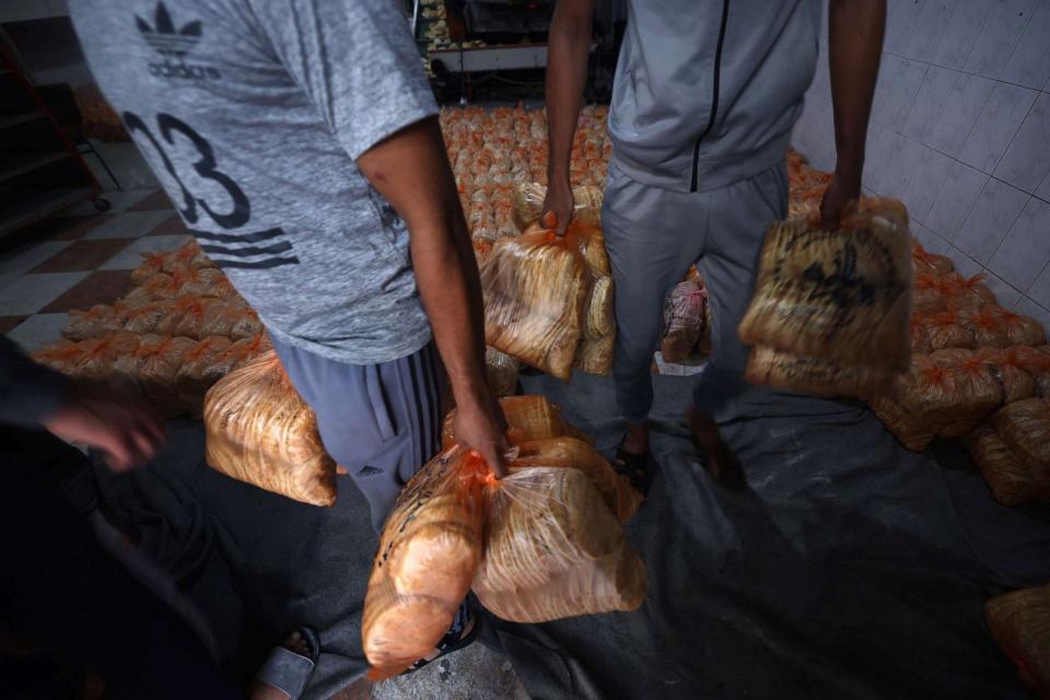 PHOTO: A bakery prepares rations of bread to pass out to internally displaced Palestinians in the Rafah refugee camp, in the southern Gaza Strip, Oct. 17, 2023. (Mohammed Abed/AFP via Getty Images)