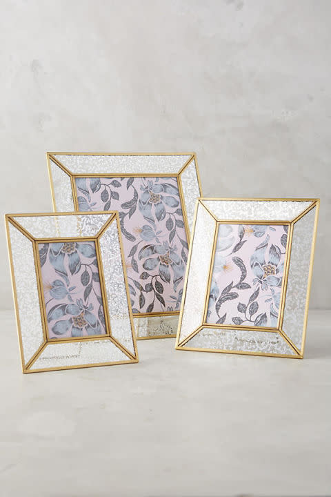 <p><em>Starting at $24</em></p><p><a rel="nofollow noopener" href="https://www.anthropologie.com/shop/mercury-glass-frame" target="_blank" data-ylk="slk:BUY NOW;elm:context_link;itc:0;sec:content-canvas" class="link ">BUY NOW</a></p><p>These handmade, brass iron and mercury glass frames come in three sizes. Gift her the whole set, then fill 'em with photos of your family from your wedding day. </p>