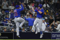 Chicago Cubs' Patrick Wisdom, right, celebrates with third base coach Willie Harris after hitting a two-run home run during the sixth inning of the team's baseball game against the San Diego Padres, Tuesday, June 8, 2021, in San Diego. (AP Photo/Gregory Bull)