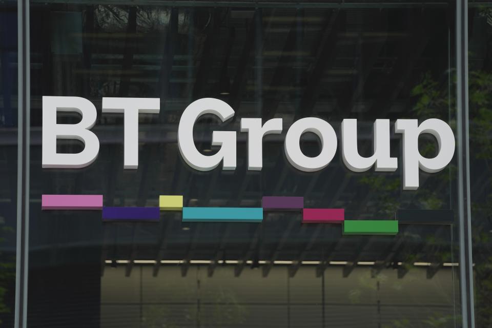 A logo of the BT group is displayed at the headquarters, in London, Thursday, May 18, 2023. U.K. telecom company BT Group said Thursday that it plans to shed up to 55,000 jobs by the end of the decade as part of an overhaul aimed at slimming down its workforce to slash costs. (AP Photo/Kin Cheung)