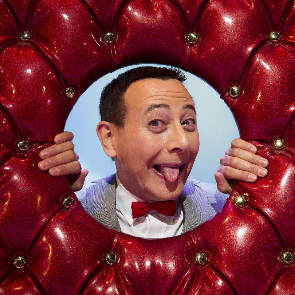 FILE - In this Friday, Oct. 29, 2010 photo, Paul Reubens, in character as Pee-wee Herman, poses on stage after a performance of "The Pee-wee Herman Show" on Broadway in New York. Reubens died Sunday night after a six-year struggle with cancer that he did not make public, his publicist said in a statement. (AP Photo/Charles Sykes, File)