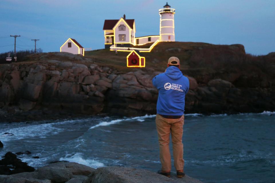 Nubble Lighthouse keeper Matt Rosenberg admires the lighthouse on Monday, Dec. 5, 2022, in York.