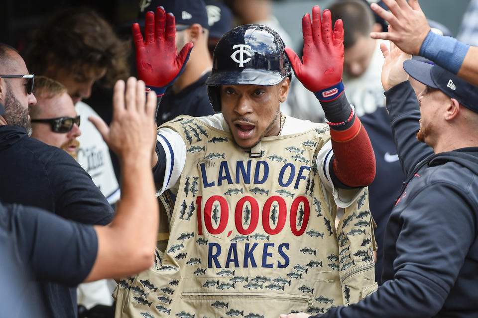 Minnesota Twins third baseman Jorge Polanco celebrates in the dugout after hitting a home run against Los Angeles Angels pitcher Andrew Wantz during the third inning of a baseball game Sunday, Sept. 24, 2023, in Minneapolis. (AP Photo/Craig Lassig)
