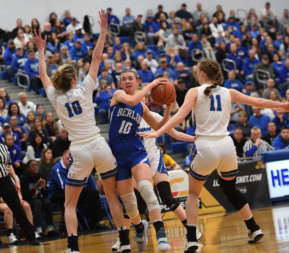 Berlin Brothersvalley's Grace Sechler, middle, tries to drive between Union Area's Kelly Cleaver (10) and Zoe Lepri (11) during a PIAA Class 1A girls basketball semifinal, March 21, at Hempfield Area High School.