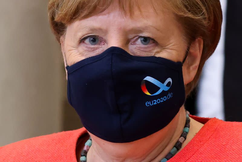 German Chancellor Angela Merkel wearing a face mask is seen after a session at the upper house of the German parliament Bundesrat, following the outbreak of the coronavirus disease (COVID-19), in Berlin