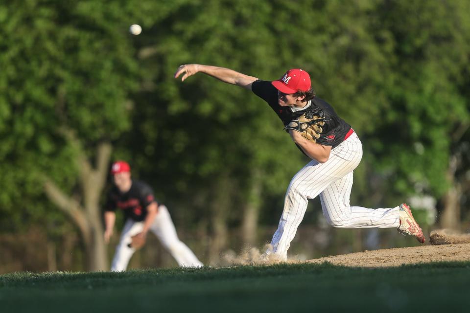 Milford’s Evan Cornelius delivers a pitch during baseball game against Hopedale at Fino Field in Milford on May 12.