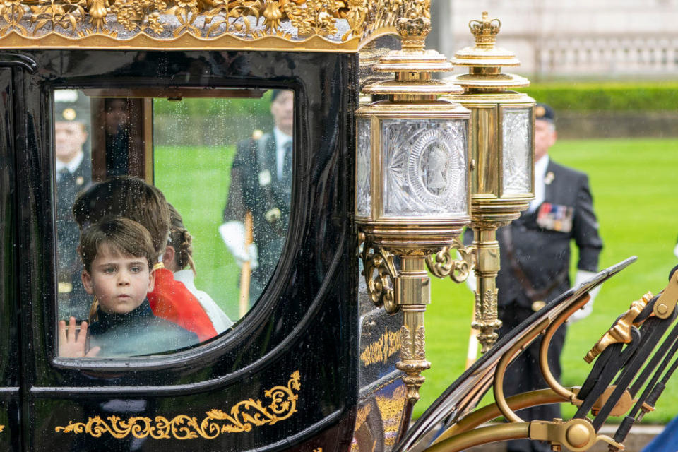 Prince Louis waving from the carriage window