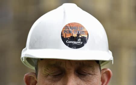 FILE PHOTO: A steel worker protests outside of the Houses of Parliament in London, October 28, 2015