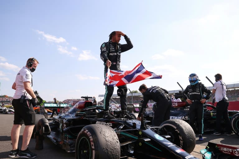 Flying the flag: Hamilton said he won for the Silverstone fans, the British flag and the national anthem