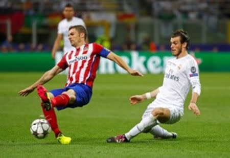 Soccer Football - Atletico Madrid v Real Madrid - UEFA Champions League Final - San Siro Stadium, Milan, Italy - 28/5/16 Atletico Madrid's Gabi in action with Real Madrid's Gareth Bale Reuters / Kai Pfaffenbach Livepic