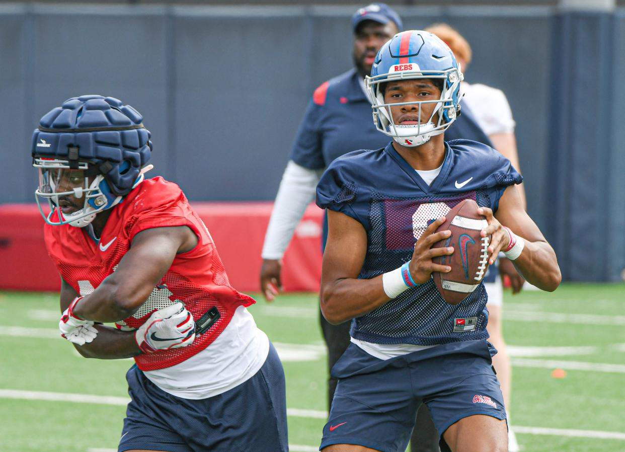 Quarterback Austin Simmons (8) throws a pass at Ole Miss football practice in Oxford, Miss., on Friday, Aug. 11, 2023.