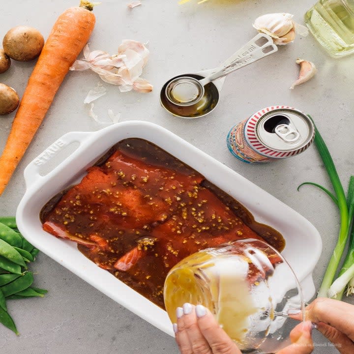 Marinating honey garlic salmon.