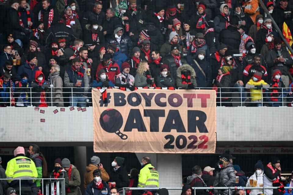 freiburg im breisgau, germany   april 02 fans of freiburg display a banner about boycotting the fifa world cup 2022 in qatar prior to the bundesliga match between sport club freiburg and fc bayern münchen at europa park stadion on april 02, 2022 in freiburg im breisgau, germany photo by matthias hangstgetty images