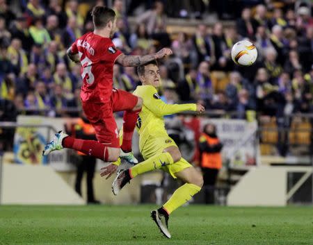 Football Soccer - Villarreal v Liverpool - UEFA Europa League Semi Final First Leg - El Madrigal Stadium, Villarreal, Spain - 28/4/16 Villarreal's Denis Suarez in action with Liverpool's Alberto Moreno Reuters / Heino Kalis Livepic