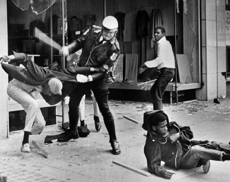 A police officer uses his nightstick on a youth reportedly involved in the looting that followed the breakup of a march led by King on March 28, 1968, in Memphis. (Photo: Jack Thornell/AP)