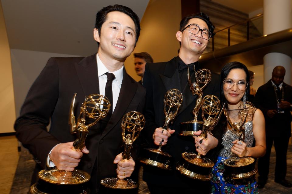 Steven Yeun, from left, Lee Sung Jin and Ali Wong at the 75th Emmy Awards at the Peacock Theater in Los Angeles on Monday.