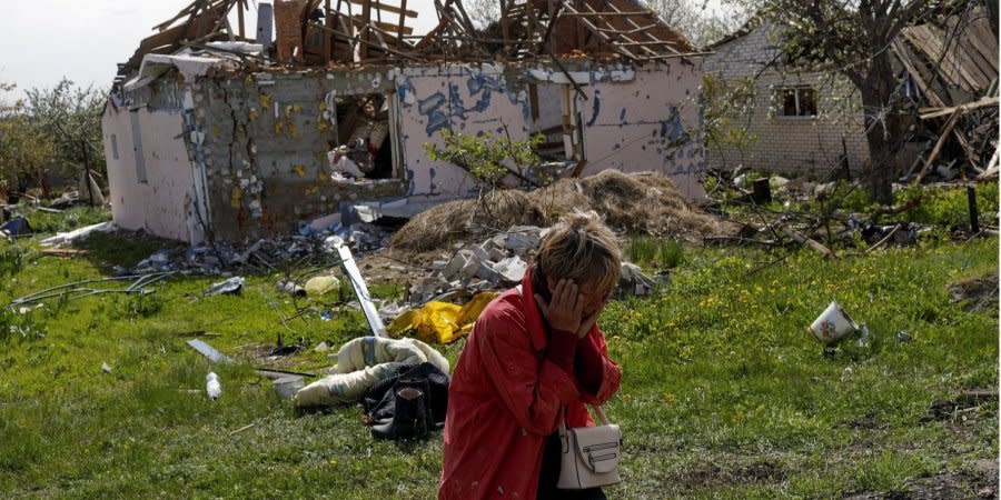 Tatiana Pochivalova near her house, which was destroyed by Russian troops, Vilkhivka village, Kharkiv Oblast