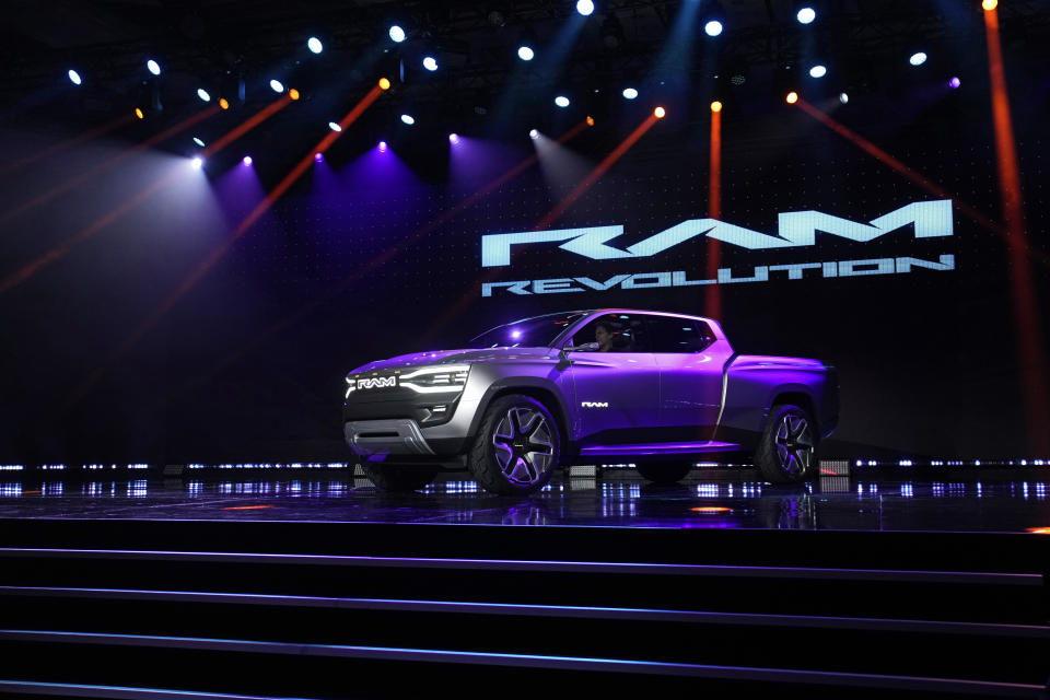 The Ram 1500 Revolution electric battery powered pickup truck is displayed on stage during the Stellantis keynote at the CES tech show Thursday, Jan. 5, 2023, in Las Vegas. (AP Photo/John Locher)