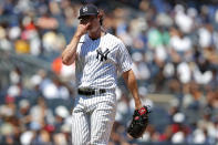 New York Yankees starting pitcher Gerrit Cole (45) reacts after a pitch against the Houston Astros during the first inning of a baseball game Saturday, June 25, 2022, in New York. (AP Photo/Noah K. Murray)
