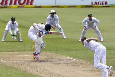 England's Stuart Broad ducks under a short ball during the first cricket test match against South Africa in Durban, South Africa, December 27, 2015. REUTERS/Rogan Ward