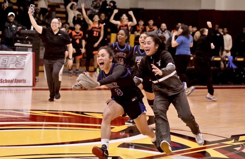 Hannah and Heart Lising sprint off the bench to celebrate with their teammates after Poly's victory Saturday at Pasadena CC.