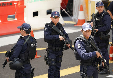 Police stand guards outside St Regis hotel in Singapore June 11, 2018. REUTERS/Athit Perawongmetha