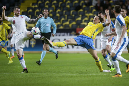 Czech Republic's Daniel Pudil (L) fights for the ball with Sweden's Zlatan Ibrahimovic during the friendly soccer match at the Friends Arena in Stockholm, Sweden March 29, 2016. REUTERS/Fredrik Sandberg/TT News Agency