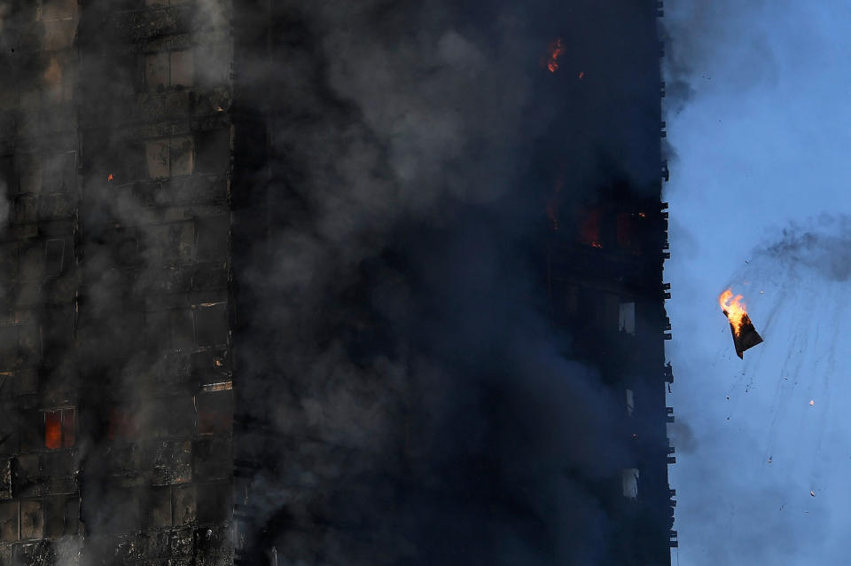 <p>Flames and smoke billow as firefighters deal with a serious fire in a tower block at Latimer Road in West London, Britain June 14, 2017. (Toby Melville/Reuters) </p>