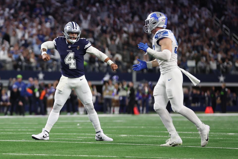 Dallas Cowboys quarterback Dak Prescott (4) reacts after throwing a touchdown pass against the Detroit Lions in the second half at AT&T Stadium.