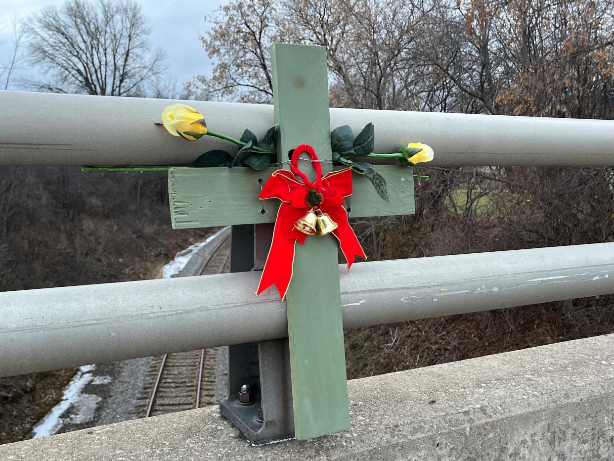 A memorial is attached to the Spencer Street rail overpass in Grand Chute where Betty Rolf's body was found in 1988.