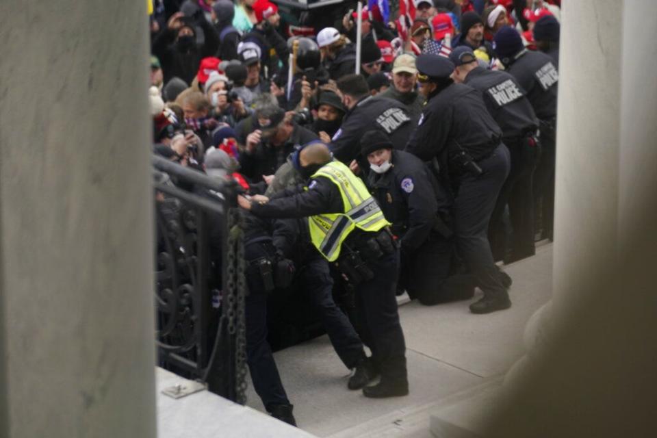 U.S. Capitol Police try to hold back protesters outside the U.S. Capitol, Wednesday, Jan 6, 2021. (AP Photo/Andrew Harnik)