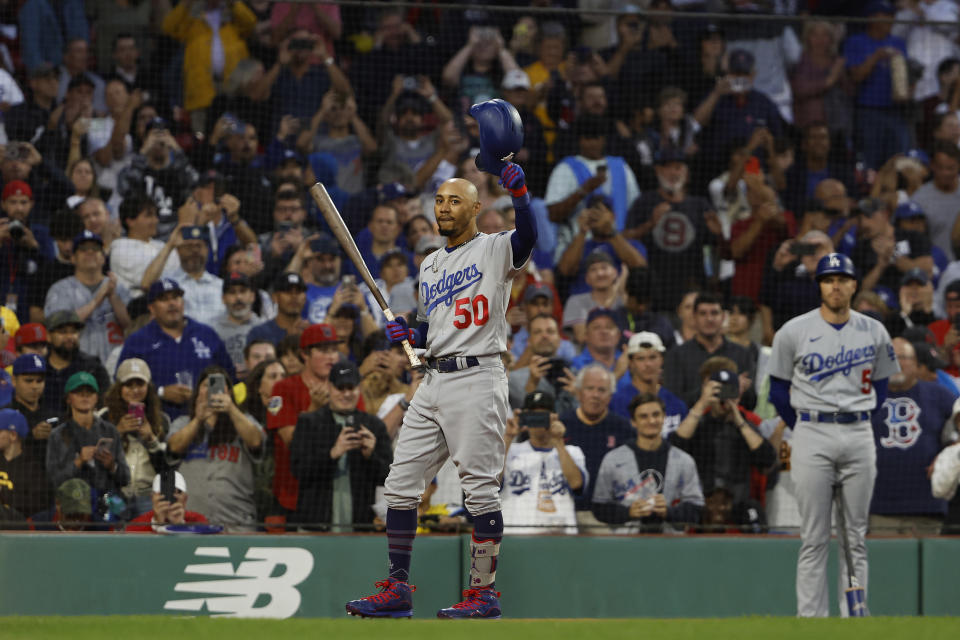 BOSTON, MA - AUGUST 25: Mookie Betts #50 of the Los Angeles Dodgers tips his hat as the fans give him a standing ovation upon his return to Fenway Park during the first inning against the Boston Red Sox on August 25, 2023 in Boston, Massachusetts. (Photo By Winslow Townson/Getty Images)