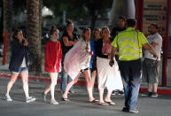 <p>People are directed to rides outside the Thomas & Mack Center after a mass shooting at a country music festival on Oct. 2, 2017 in Las Vegas. (Photo: Ethan Miller/Getty Images) </p>