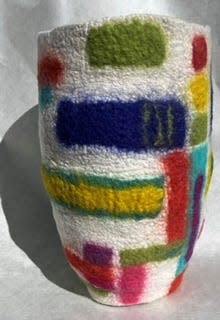 A fiber art vase by artist Sherry Tamburo