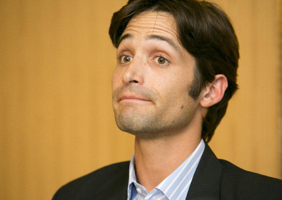 Plaintiff Michael Egan takes questions from to the media during a news conference in Beverly Hills, Calif., Thursday, April 17, 2014. A sex abuse lawsuit by Egan, a former child model and aspiring actor is accusing "X-Men" franchise director Bryan Singer of sexually abusing him as a teenager in a federal lawsuit filed in Hawaii. Singer's attorney, Marty Singer, said in a statement that the claims are absurd and defamatory. (AP Photo/Damian Dovarganes)