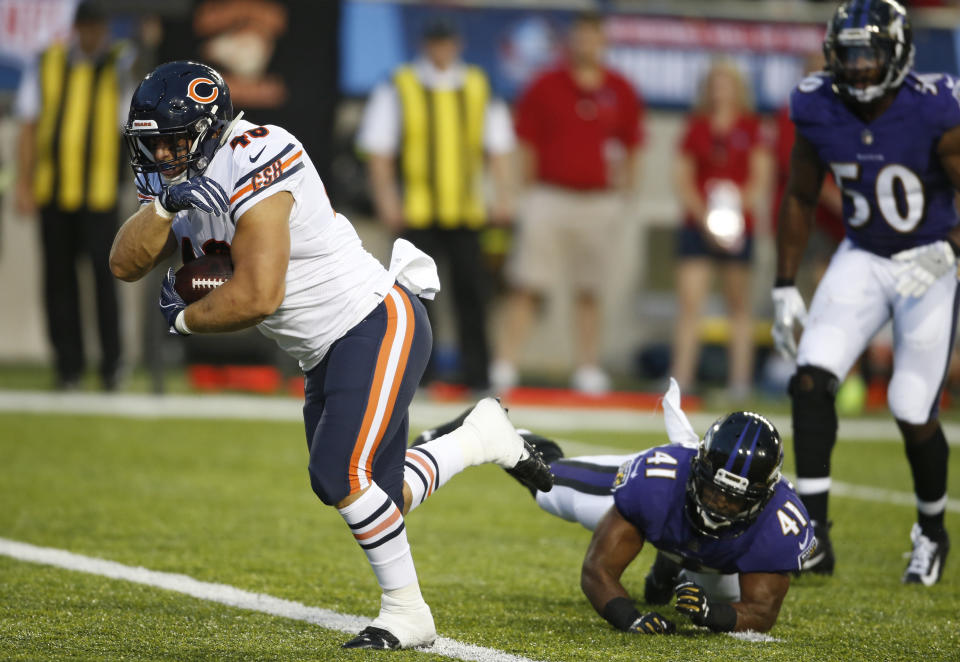 Chicago Bears fullback Michael Burton, left, scores against the Baltimore Ravens on a pass reception during the first half at the Pro Football Hall of Fame NFL preseason game Thursday, Aug. 2, 2018, in Canton, Ohio. (AP Photo/Ron Schwane)