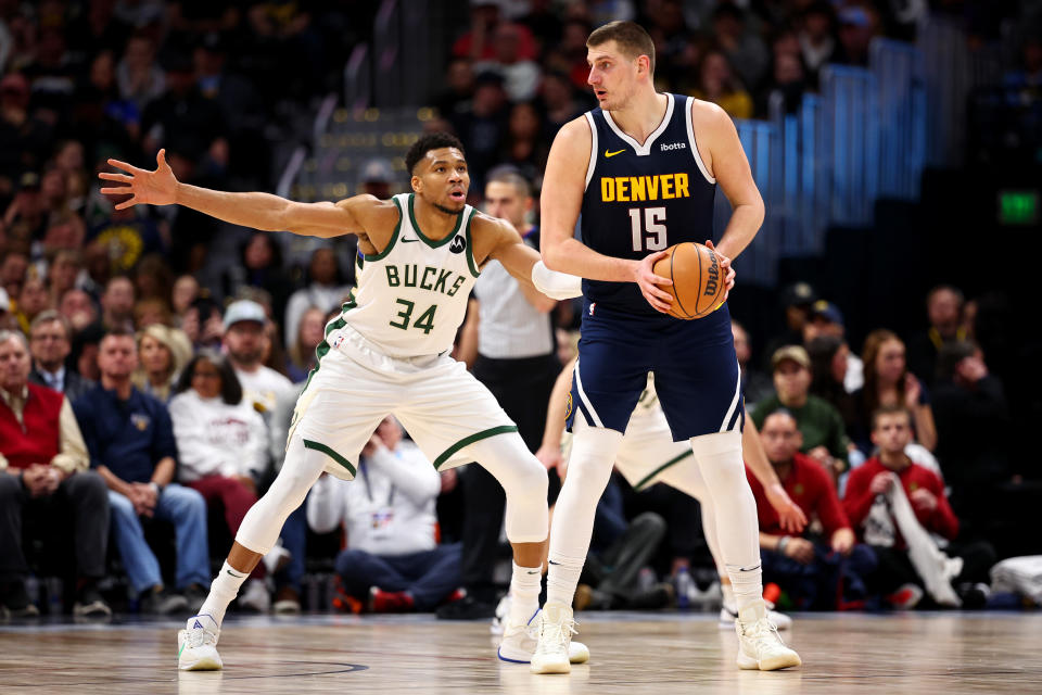 DENVER, COLORADO - JANUARY 29: Nikola Jokic #15 of the Denver Nuggets backs down Giannis Antetokounmpo #34 of the Milwaukee Bucks at Ball Arena on January 29, 2024 in Denver, Colorado. NOTE TO USER: User expressly acknowledges and agrees that, by downloading and/or using this Photograph, user is consenting to the terms and conditions of the Getty Images License Agreement. (Photo by Jamie Schwaberow/Getty Images)