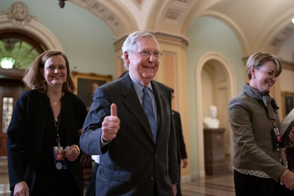 Senate Majority Leader Mitch McConnell, R-Ky., gives a thumbs-up as he leaves the chamber after Republicans defeated Democratic amendment to subpoena key witnesses in the impeachment trial of President Donald Trump on Friday.