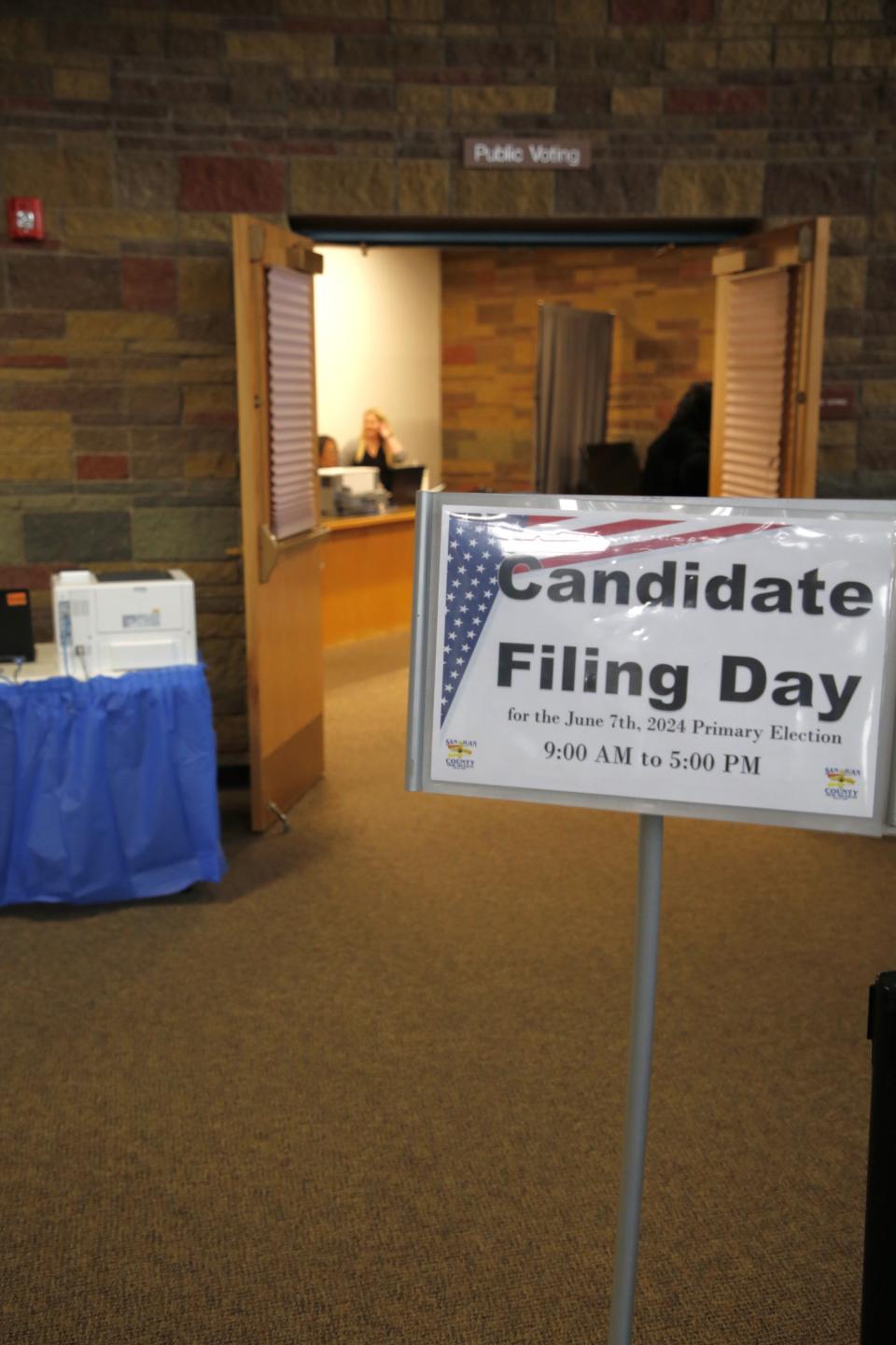 A sign greeting potential candidates stands outside the San Juan County clerk's office in Aztec on Tuesday, March 12 as filing day was held.