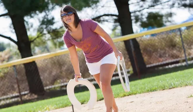 People are tossing toilet seats as horseshoes during the Millsboro Country Festival in 2014.