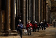 People sit down and relax after receiving their Pfizer-BioNTech vaccination at Salisbury Cathedral in Salisbury, England, Wednesday, Jan. 20, 2021. Salisbury Cathedral opened its doors for the second time as a venue for the Sarum South Primary Care Network COVID-19 Local Vaccination Service. (AP Photo/Frank Augstein)