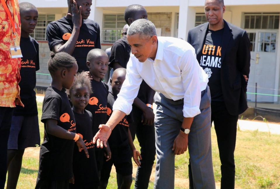 President Barack Obama met with children as he toured the Sauti Kuu resource centre ear his ancestral home in Nyangoma Kogelo village in Siaya county, western Kenya (REUTERS)