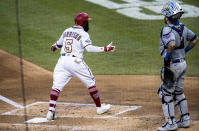 Washington Nationals' Josh Harrison (5) gestures toward the team's dugout after stepping on home with a home run during the second inning of the team's baseball game against the New York Mets in Washington, Tuesday, Aug. 4, 2020. (AP Photo/Manuel Balce Ceneta)